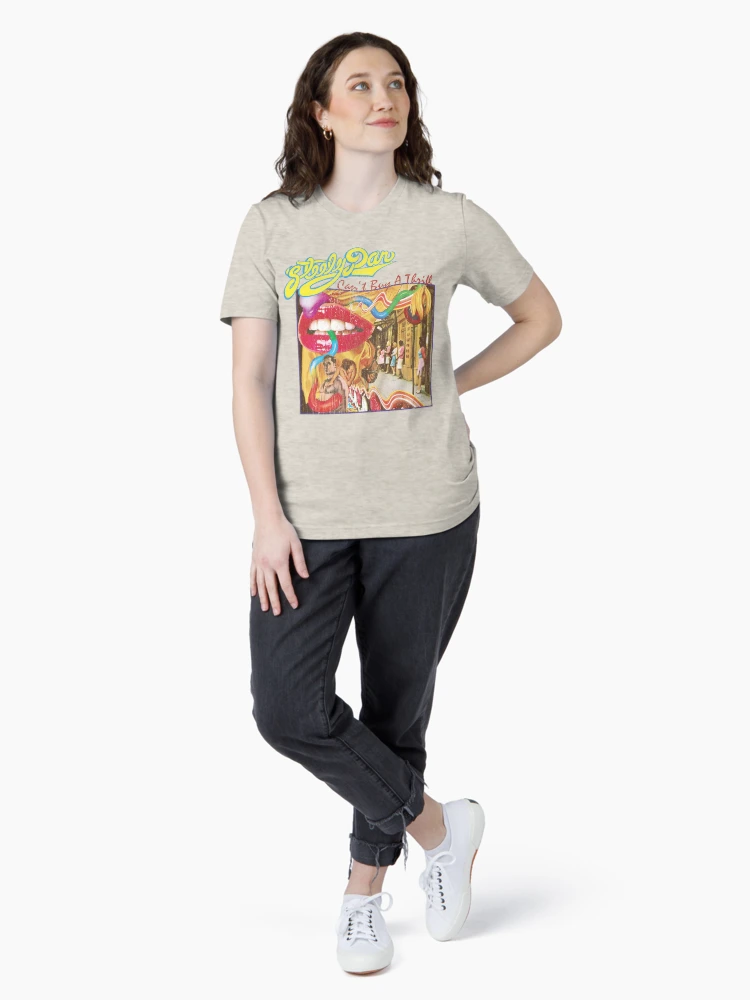 Aperçu 4 sur 7. T-shirt essentiel avec l'œuvre Steely Dan: Can't Buy A Thrill créée et vendue par brianhillDESIGN.