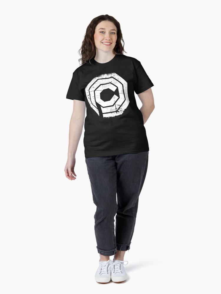 Aperçu 4 sur 7. T-shirt classique avec l'œuvre Emblème octogonal d'entreprise futuriste de science-fiction à l'aspect vieilli créée et vendue par DeclanRandall.
