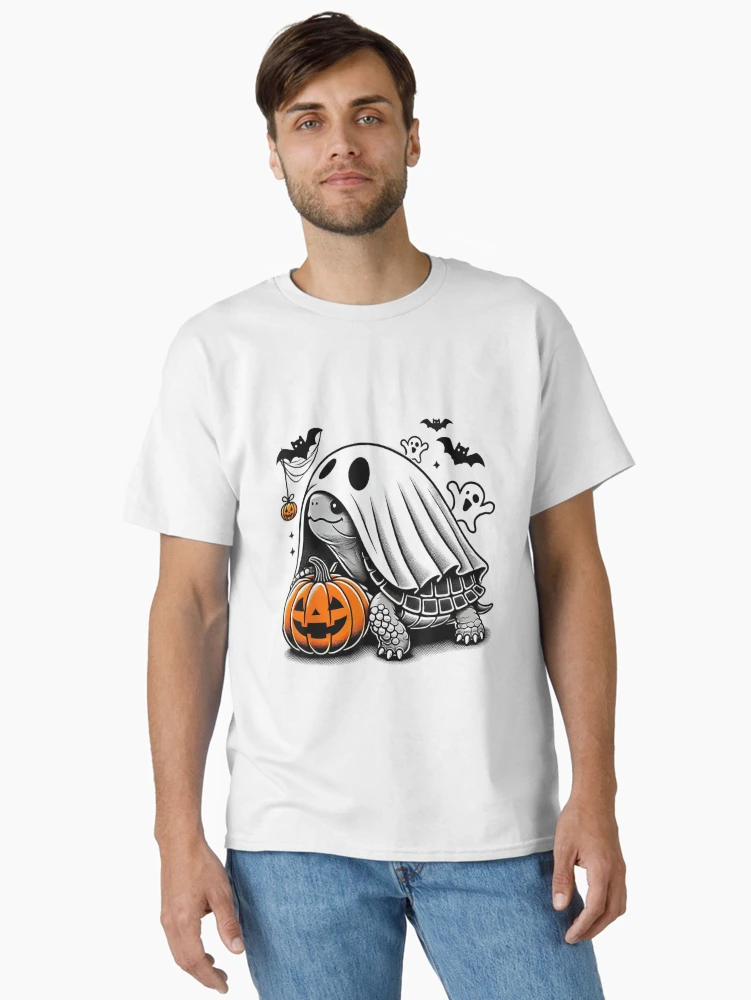 Aperçu 2 sur 7. T-shirt classique avec l'œuvre Déguisement de tortue fantôme citrouille pour Halloween créée et vendue par Suzu Comena.