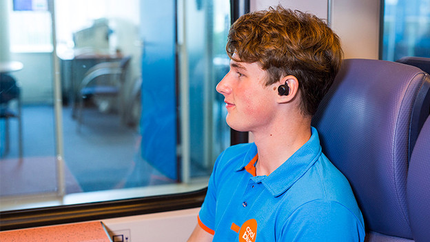 Test earbuds on the train