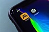 Phone screen with Claude AI and ChatGPT app icons next to each other