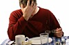 depressed man dines at empty plate