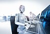 Robots working at desktop computers in an office