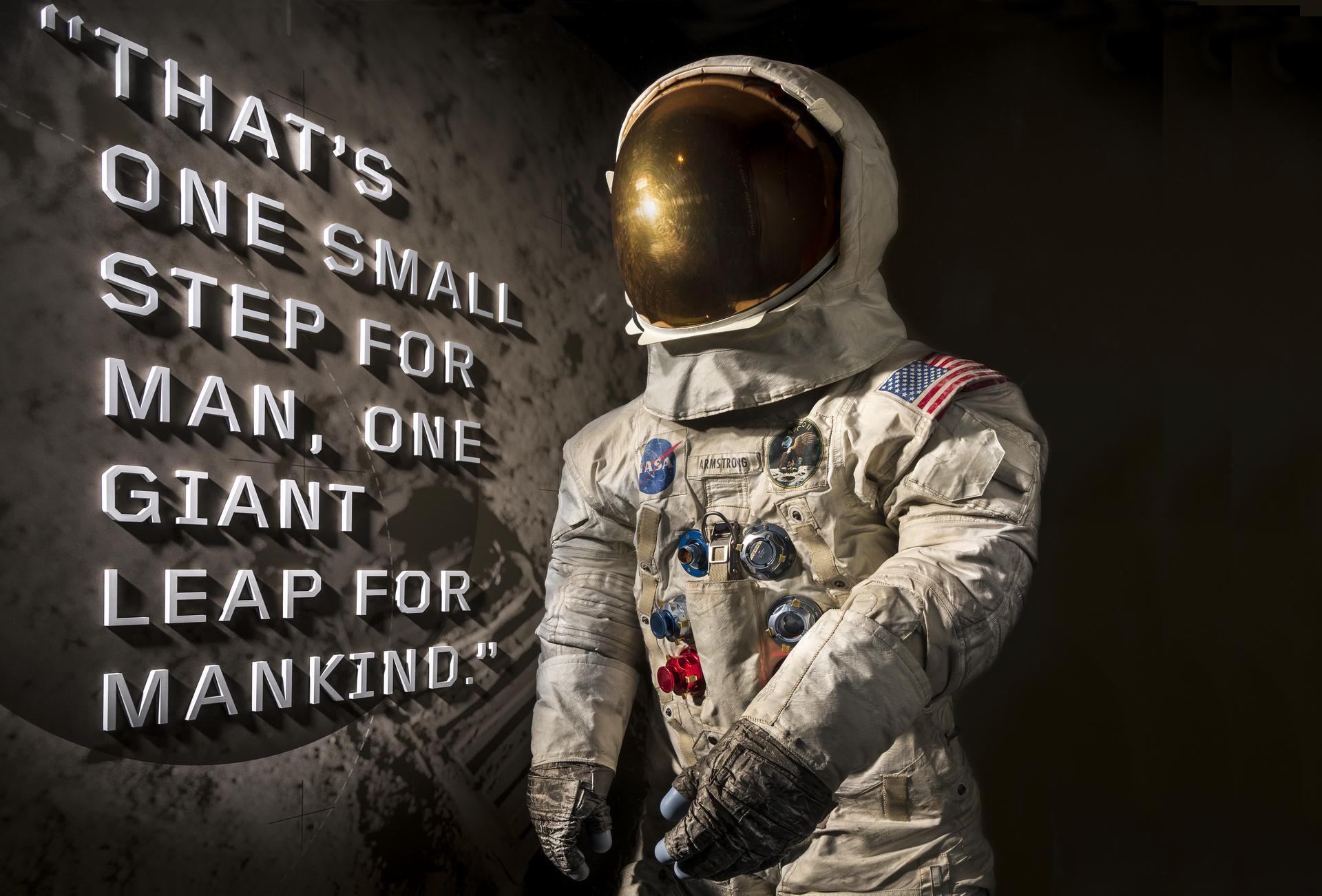 A spacesuit display showing Neil Armstrong's Pressure Suit, A7-L, which he wore to walk on the Moon, with the first words he spoke on the surface d...