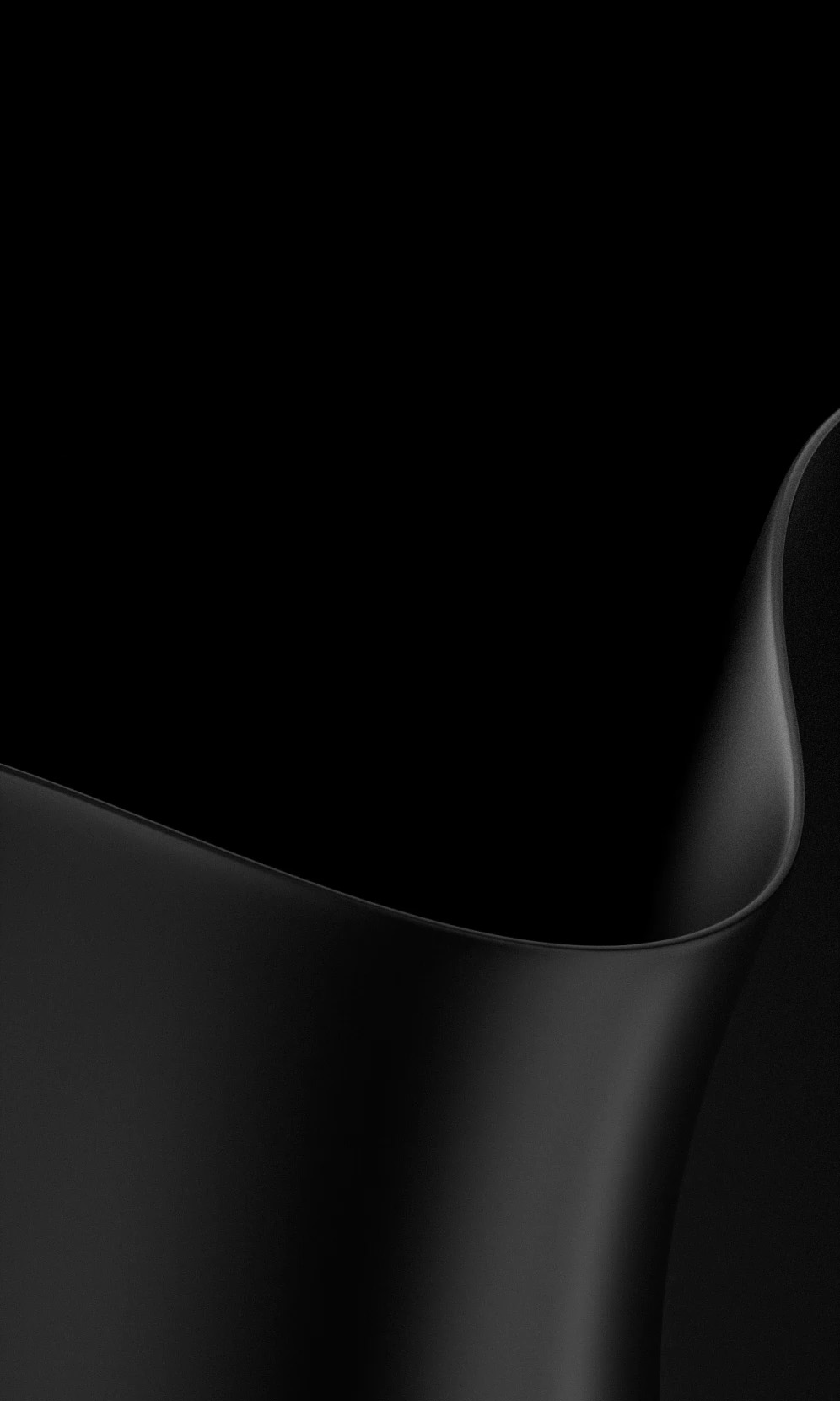 Close-up of black Surface Laptop with curved, matte metal edges.