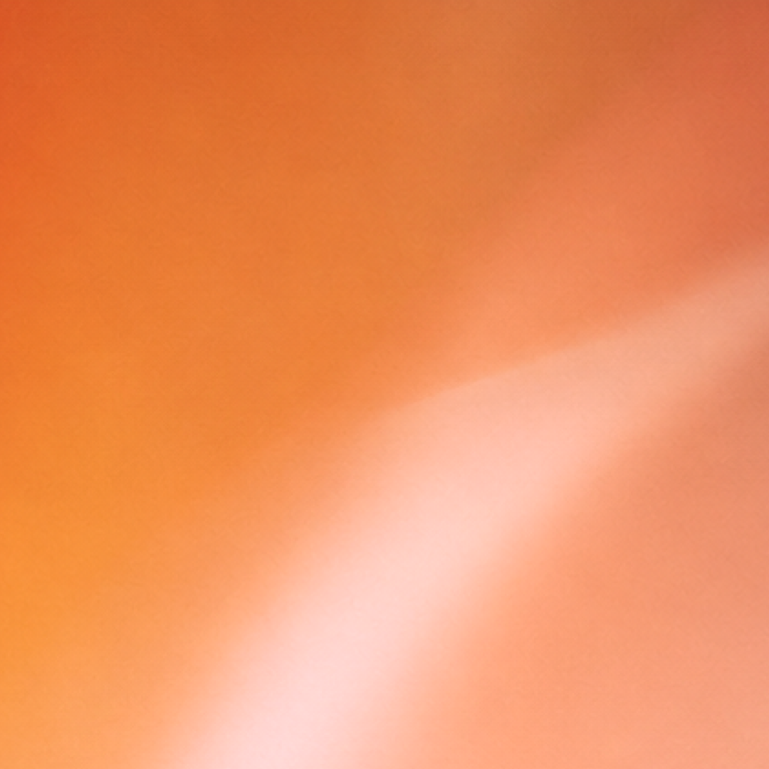 Abstract orange wallpaper with soft peach highlights.