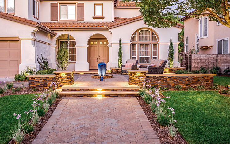 Front paver walkway with stairs and paver driveway
