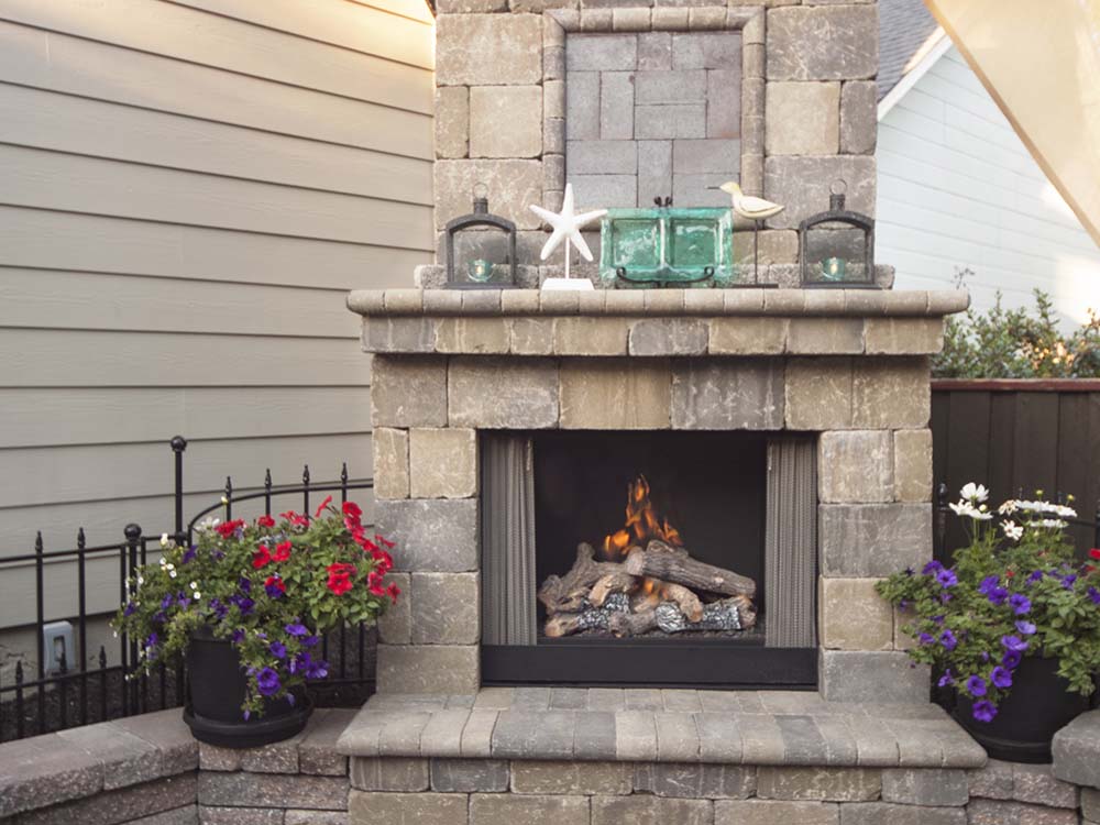 Outdoor stone fireplace with coastal look