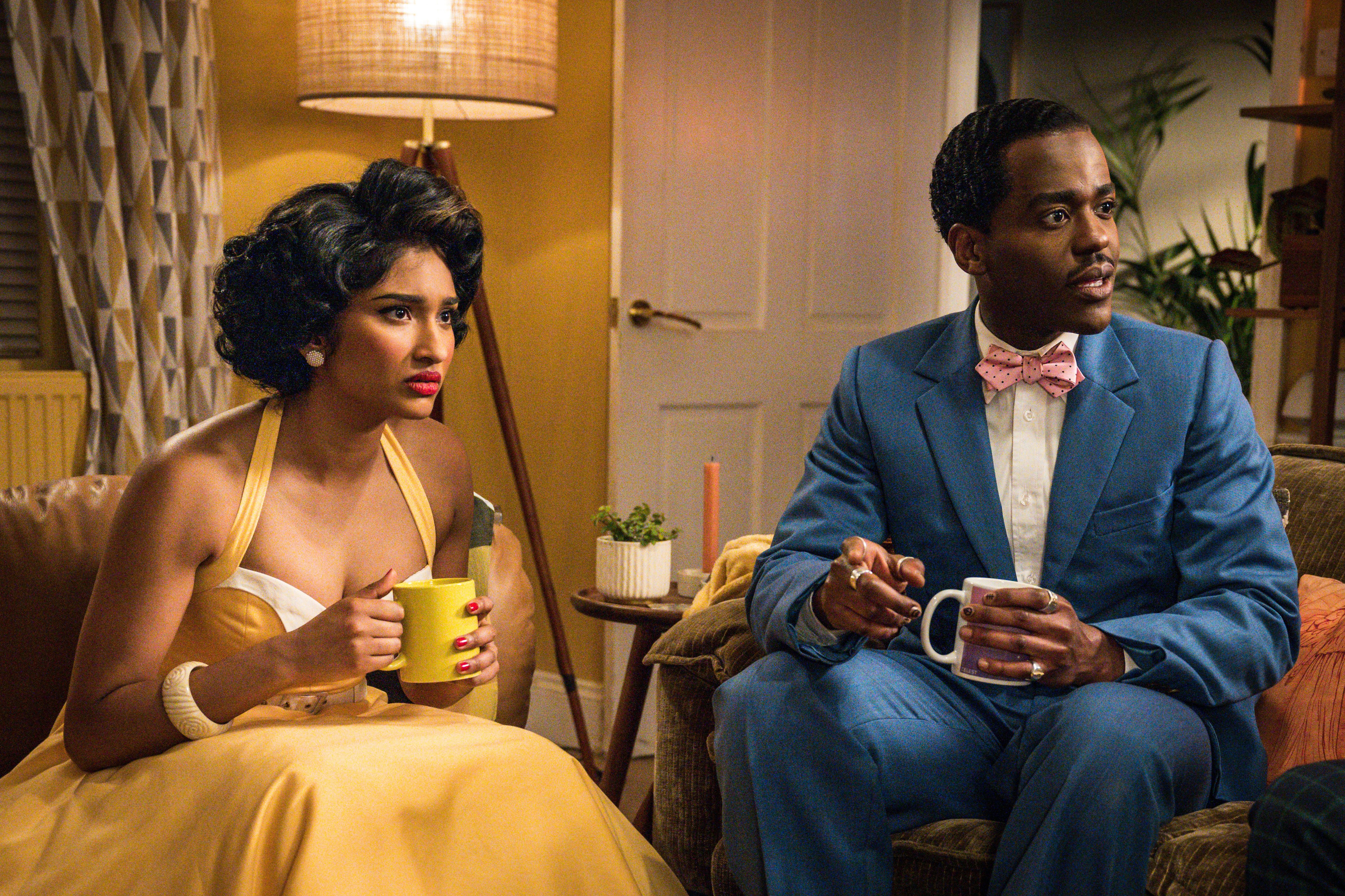 Doctor Who S2 Varada Sethu and Ncuti Gatwa sat in 1950s attire looking shocked