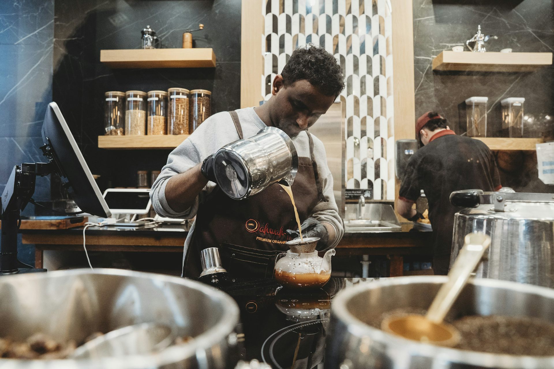 Man prepares coffee