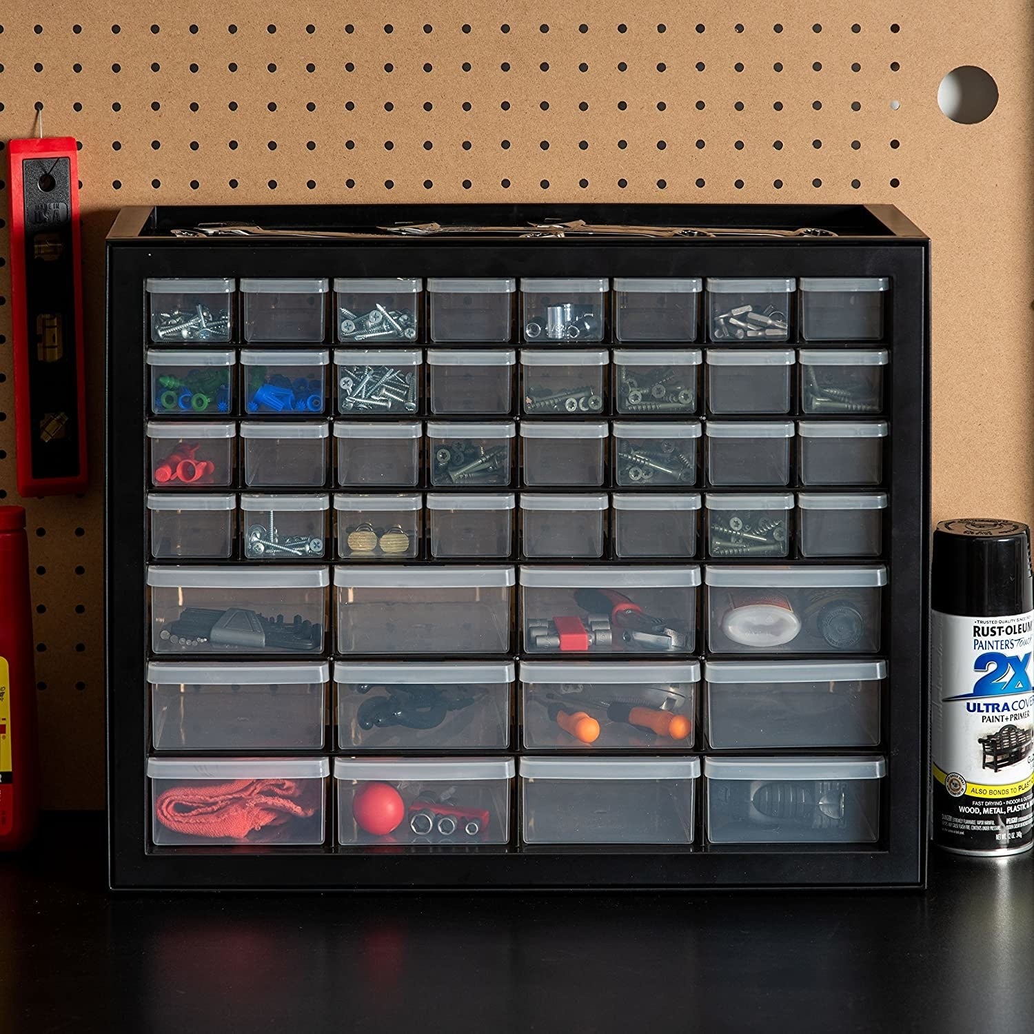 the drawer organizer filled with various nuts and bolts