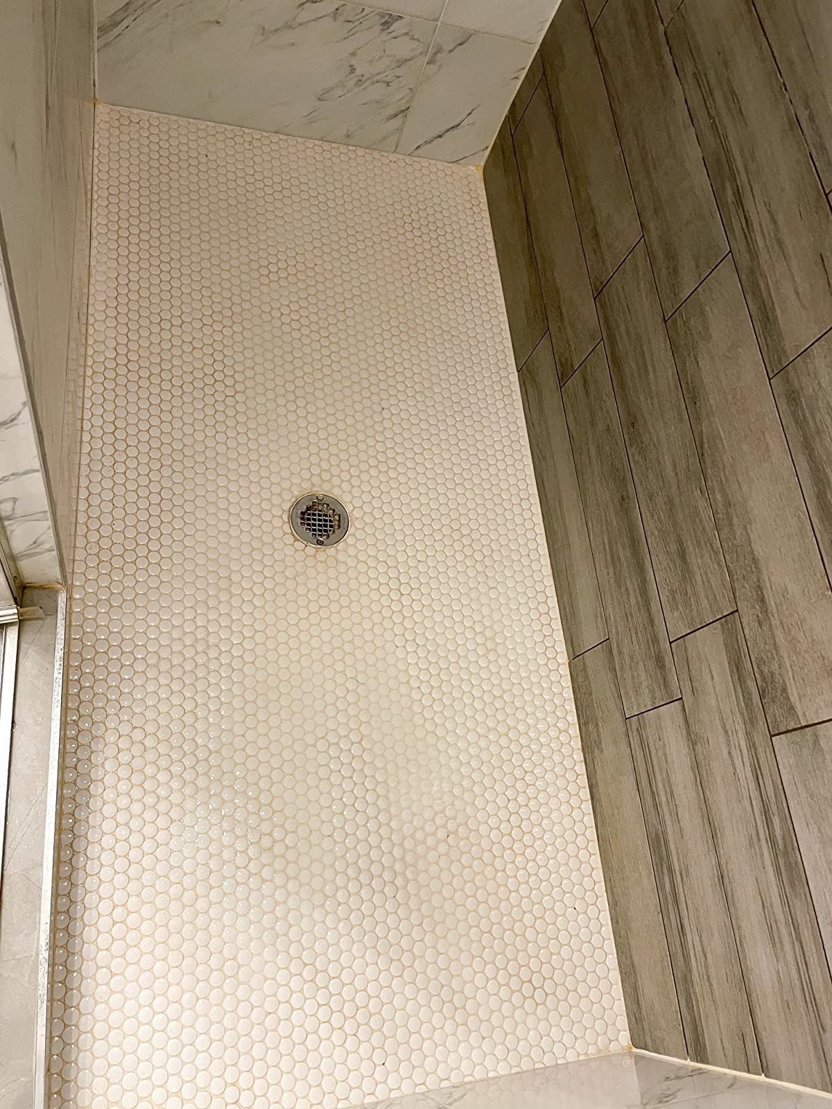 after image of the same shower floor now stain-free and completely clean