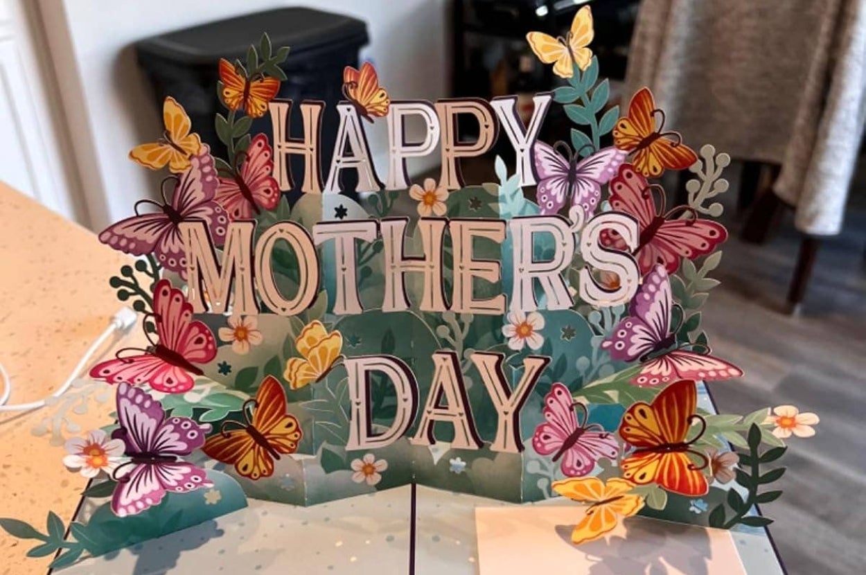 Floral pop-up card with butterflies and flowers displaying the text "Happy Mother's Day."