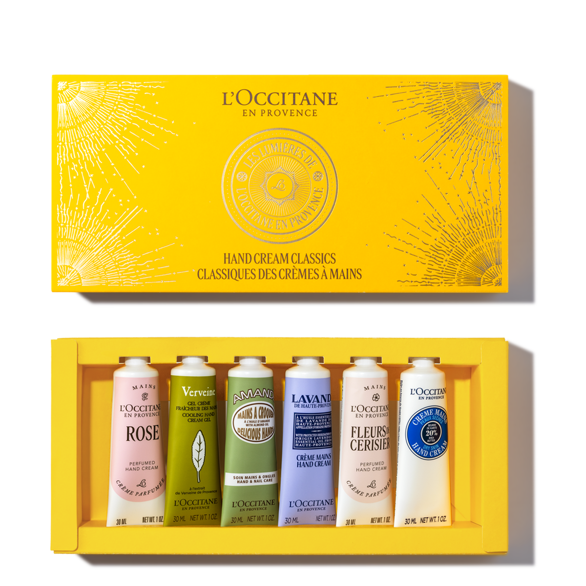 L'Occitane gift set featuring six hand cream tubes in an open yellow box, highlighting scents like rose, verbena, and lavender