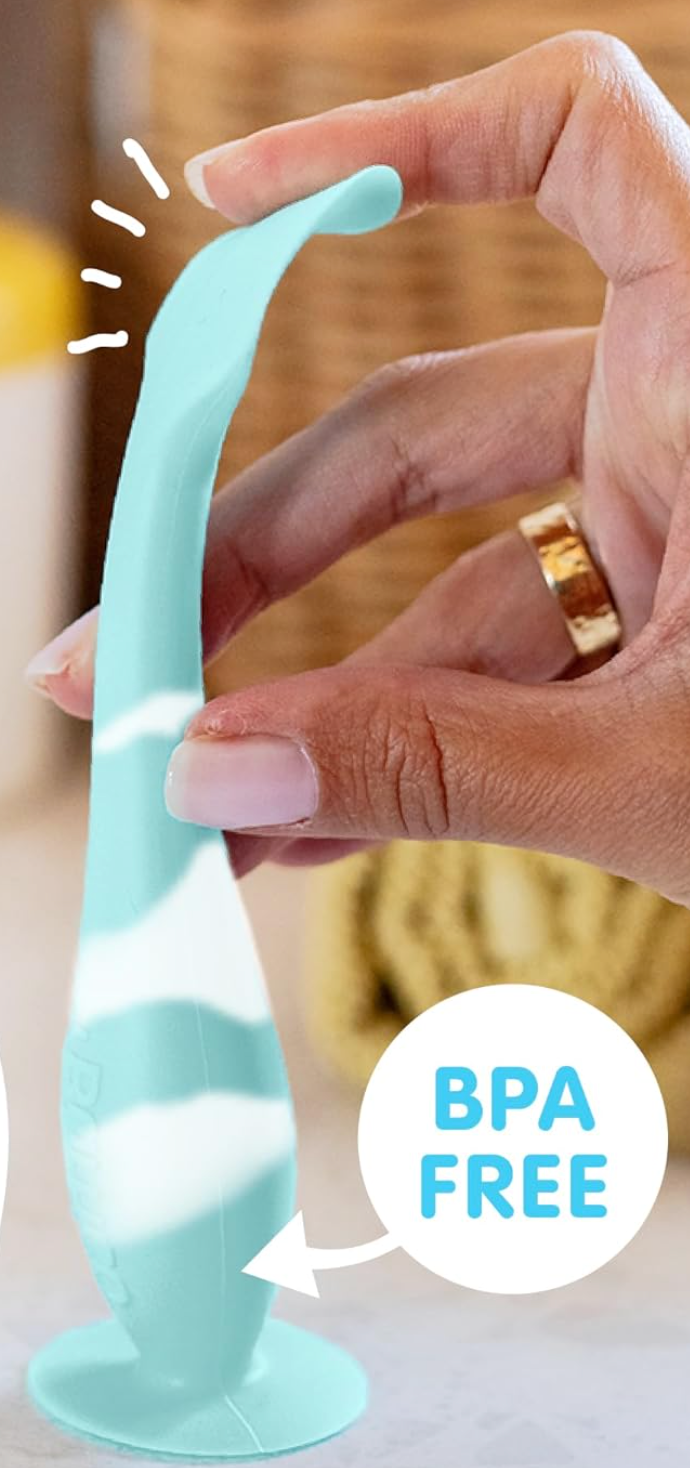 Hand holding a BPA-free flexible silicone kitchen tool with a long, curved end