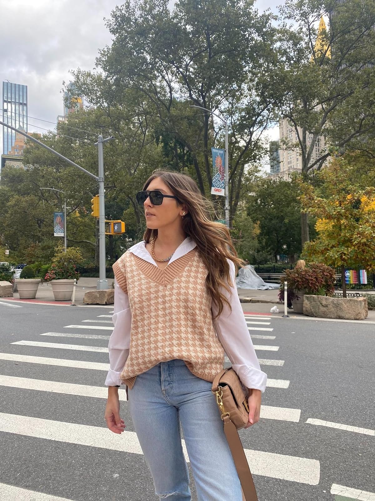 a reviewer wearing the vest in khaki