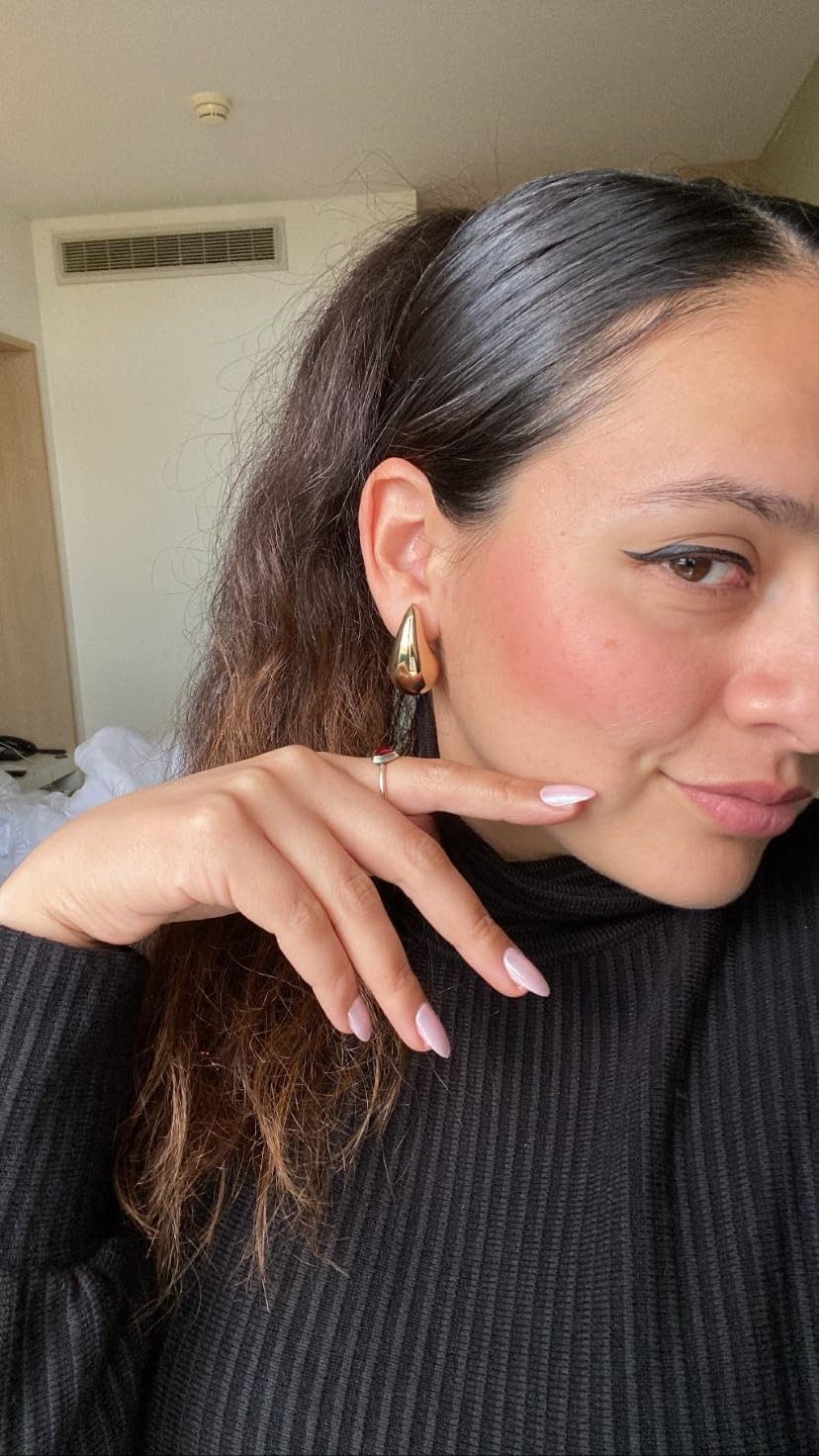 the reviewer wearing the earrings