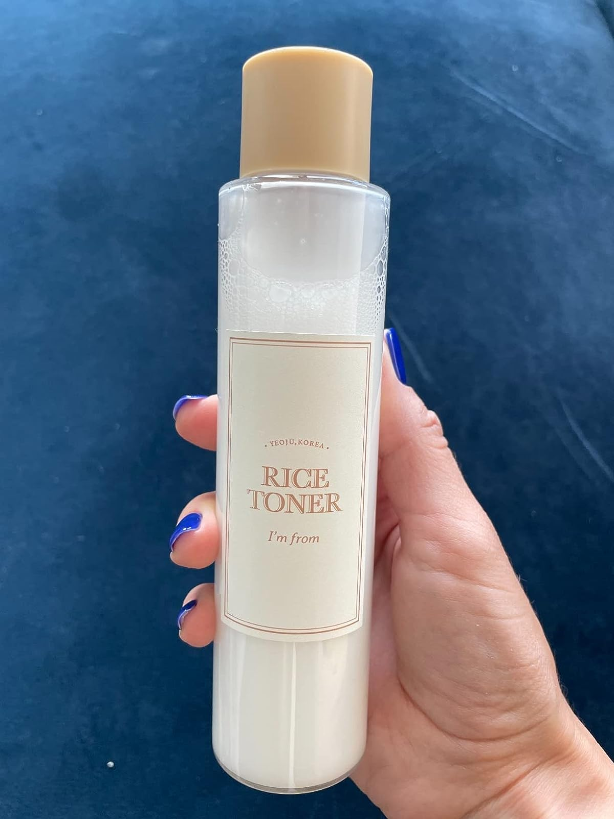 A reviewer holding the toner