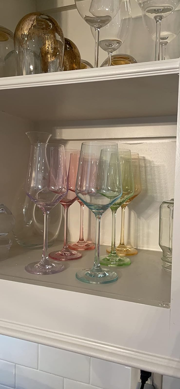 reviewer photo of the glasses in a cabinet