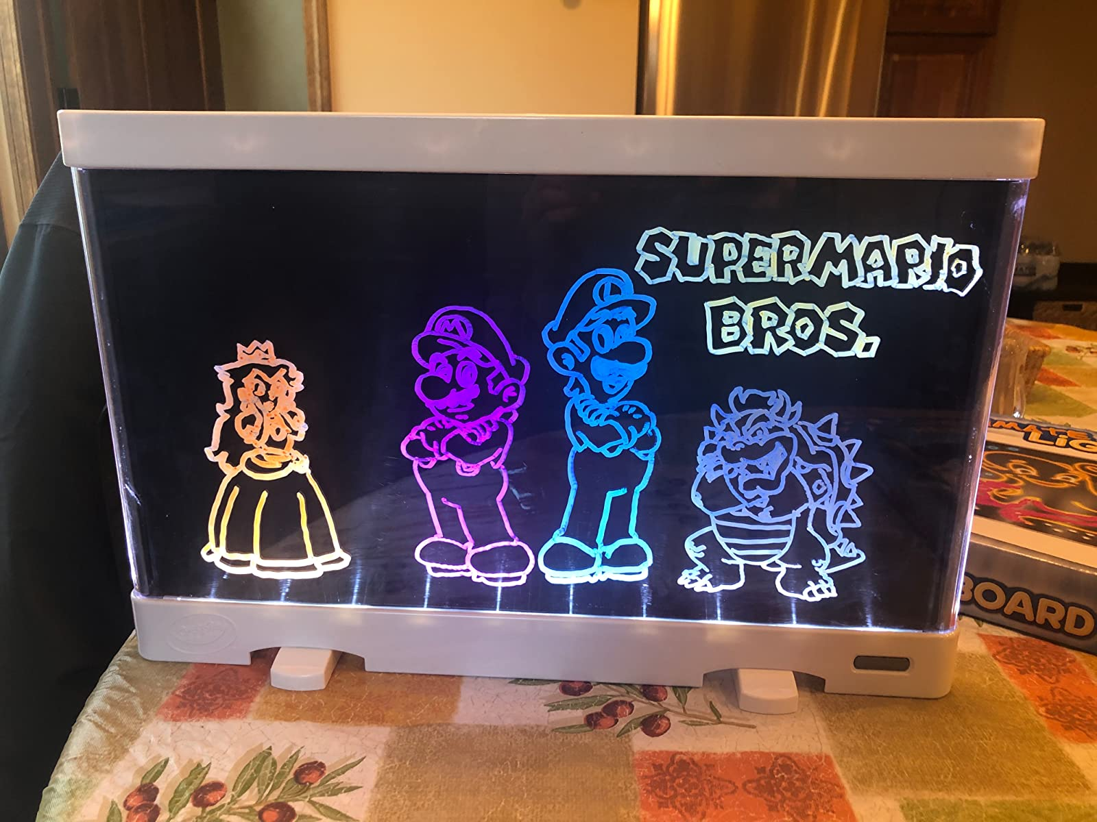 Reviewer's photo showing their drawing illuminated on the light board