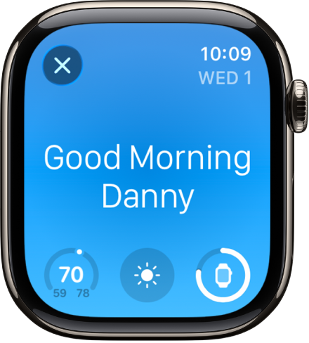 Apple&nbsp;Watch showing the wake up screen. The words Good Morning appear at the top. The temperature, weather condition, and battery level are below.