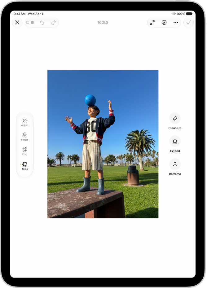 The Clean Up, Extend, and Reframe buttons next to a photo being edited in the Photos app.