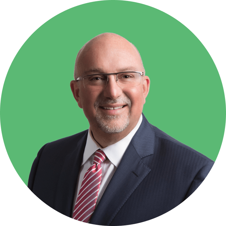 Michael R. McCormick in front of a green background.