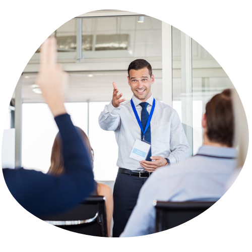 Trainer Man gesturing during business skills courseware training