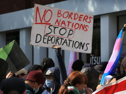 LONDON, ENGLAND - SEPTEMBER 24: A counter demonstration forms near the Home Office with a