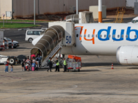Passengers board a flydubai flight, bound for Dubai, before taking off from Ben Gurion Air