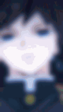 a blurry picture of a person 's face with a blue background .