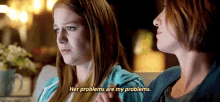two girls are sitting next to each other and one girl says her problems are my problems