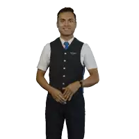 a man in a vest and tie with a badge that says ' airways ' on it