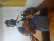 a man taking a selfie with a bottle of alcohol