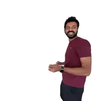 a man with a beard wearing a maroon t-shirt and black shorts