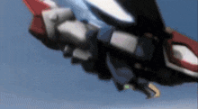 a robot is flying through the air with a blue sky behind it