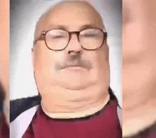 a man with glasses and a mustache is looking at the camera