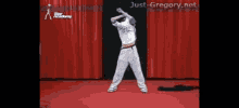 a man is dancing on a stage with just-gregory.net written on the bottom of the screen