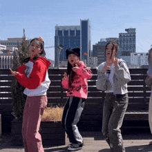 a girl wearing a pink sweatshirt that says " i love you "