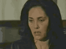 a close up of a woman 's face with the words xnoveleira written on the bottom