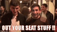 a group of men are standing in a crowd with the words out your seat stuff