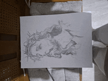 a black and white drawing of jesus with a crown of thorns