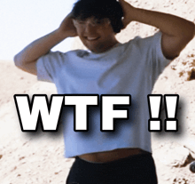 a man wearing headphones and a white shirt says wtf