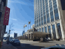 a tall building with a red sign that says acm on it