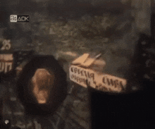 a tv screen shows a cooking scene with a 24 ack logo in the upper right corner