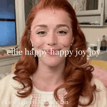 a woman with red hair is smiling with the words " ellie happy happy joy joy " below her
