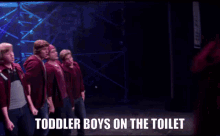 a group of toddler boys are on the toilet