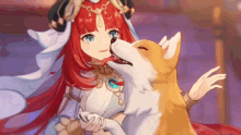 a girl with red hair is holding a dog and licking it .