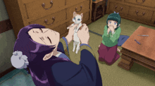 a woman with purple hair is holding a cat