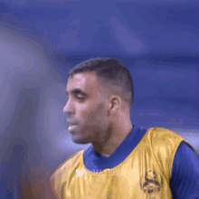 a blurred image of a soccer player with the hashtag @imaanbaz